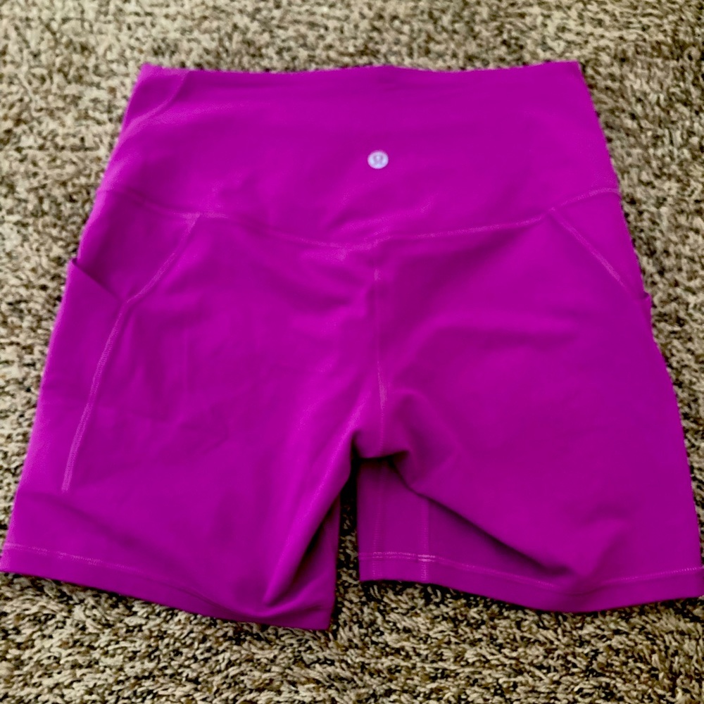 Lululemon vivid plum biker shorts.  High rise short with pockets.